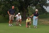 Dave Johnson, Tom Field, Rosemary Johnson, and Candy Field, line up a crucial putt